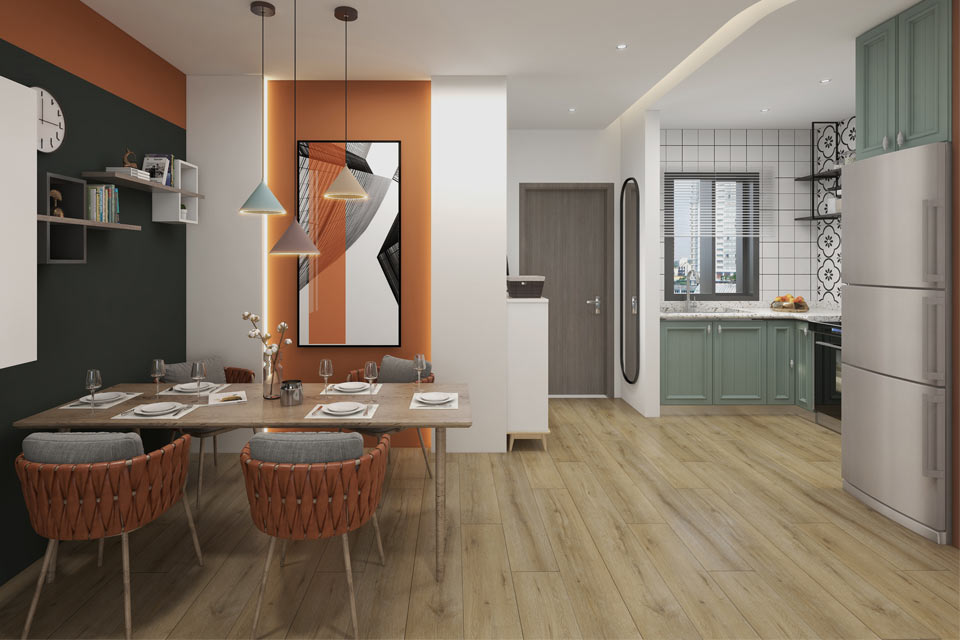 wood look flooring in kitchen with green cabinets and dining table with orange chairs.